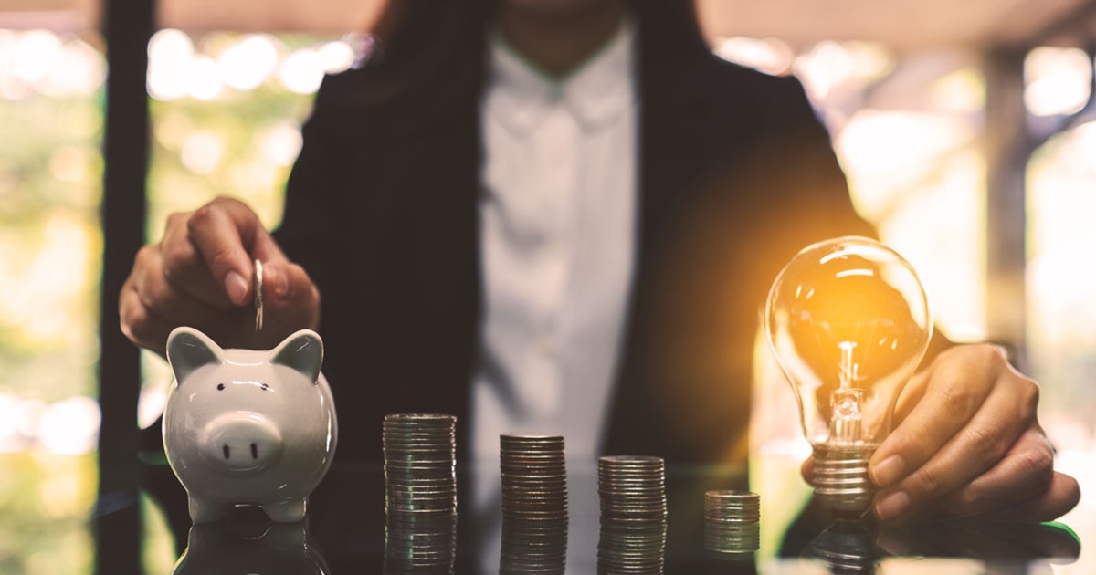 Woman saving money with idea bulb