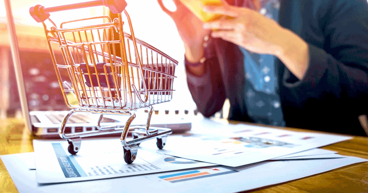 Person on phone with shopping cart