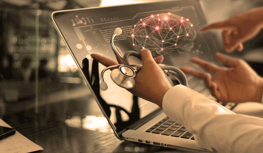 Doctors pointing at virtual brain on pc
