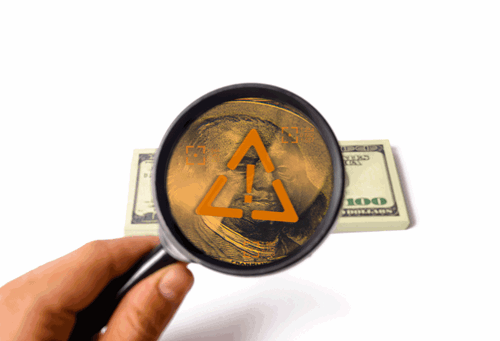 Magnifying glass with blocked view of money