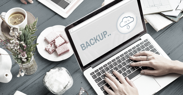 laptop backing up to the cloud, symbolizing the advantage of disaster recovery in a hybrid cloud solution