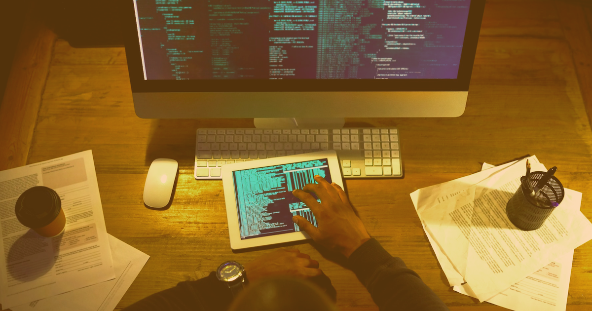 cross platform app development image displaying a tablet and PC on a desk